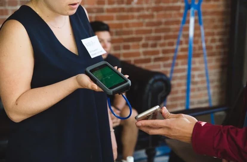 Someone scanning a digital ticket at a concert